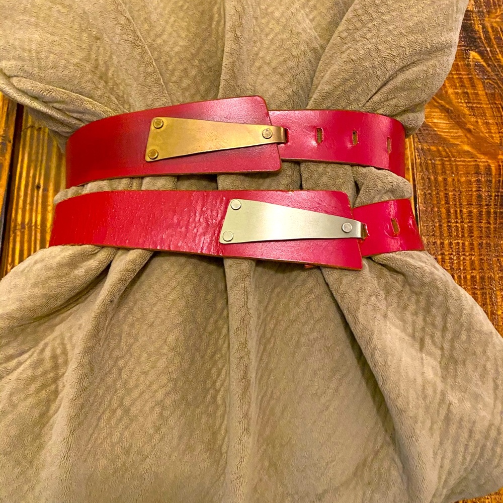 Vintage red leather and metal clasps belts